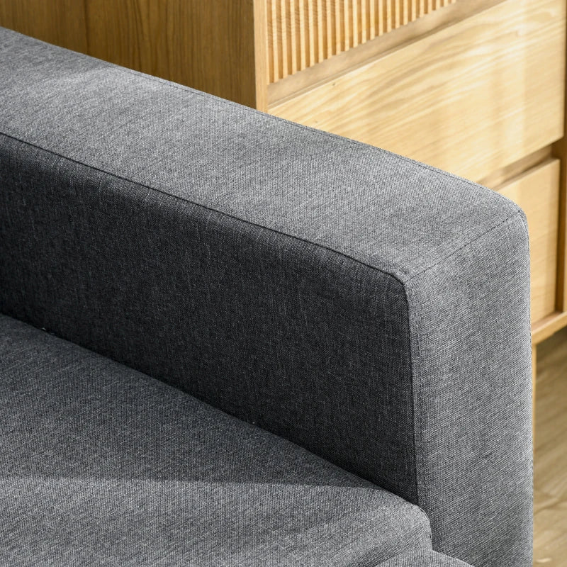 Gray upholstered chair with wooden panel background