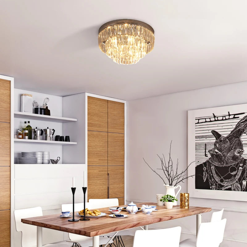 Modern dining room with a chandelier, wooden table, and decorative elements.