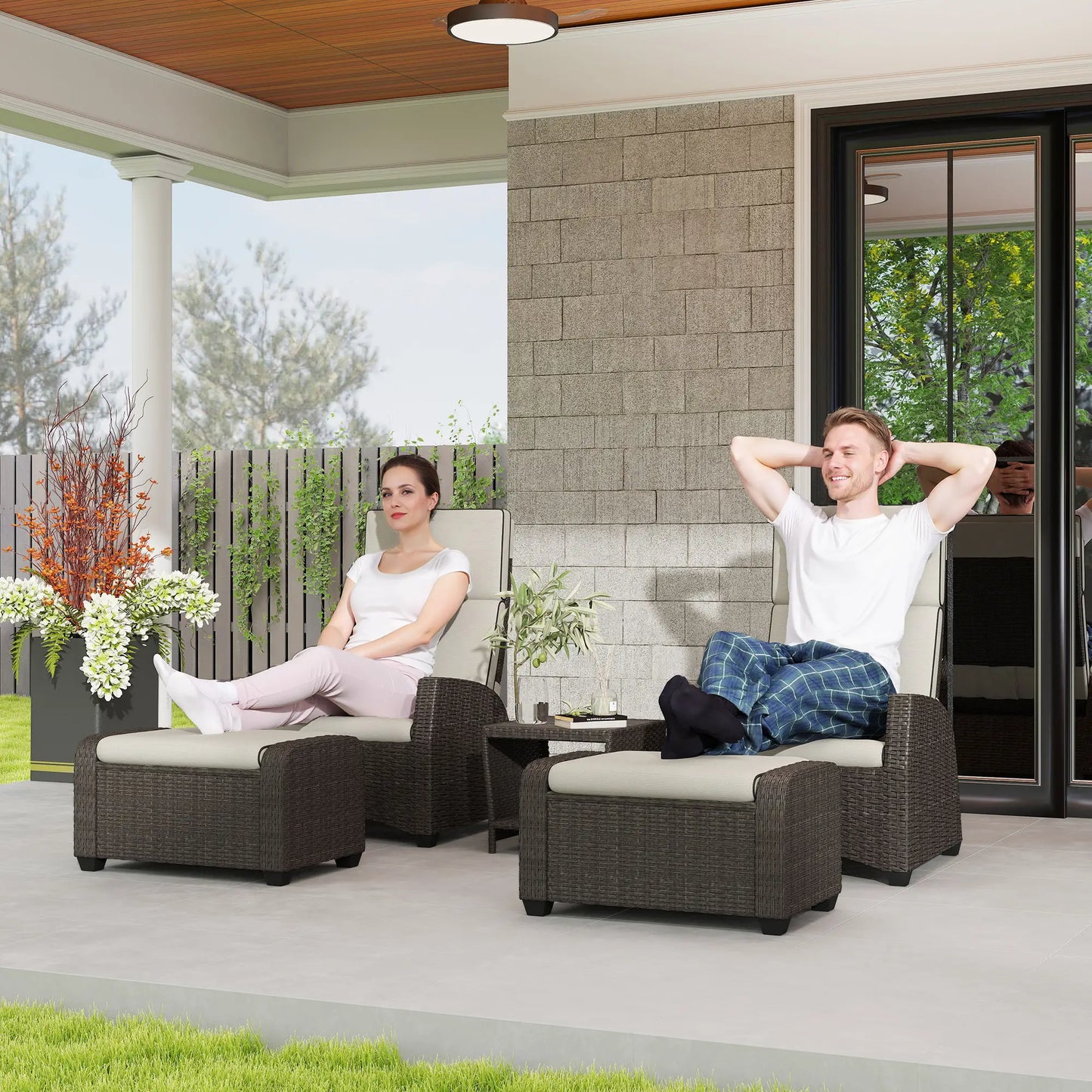 Two people relaxing on patio furniture in a backyard setting.