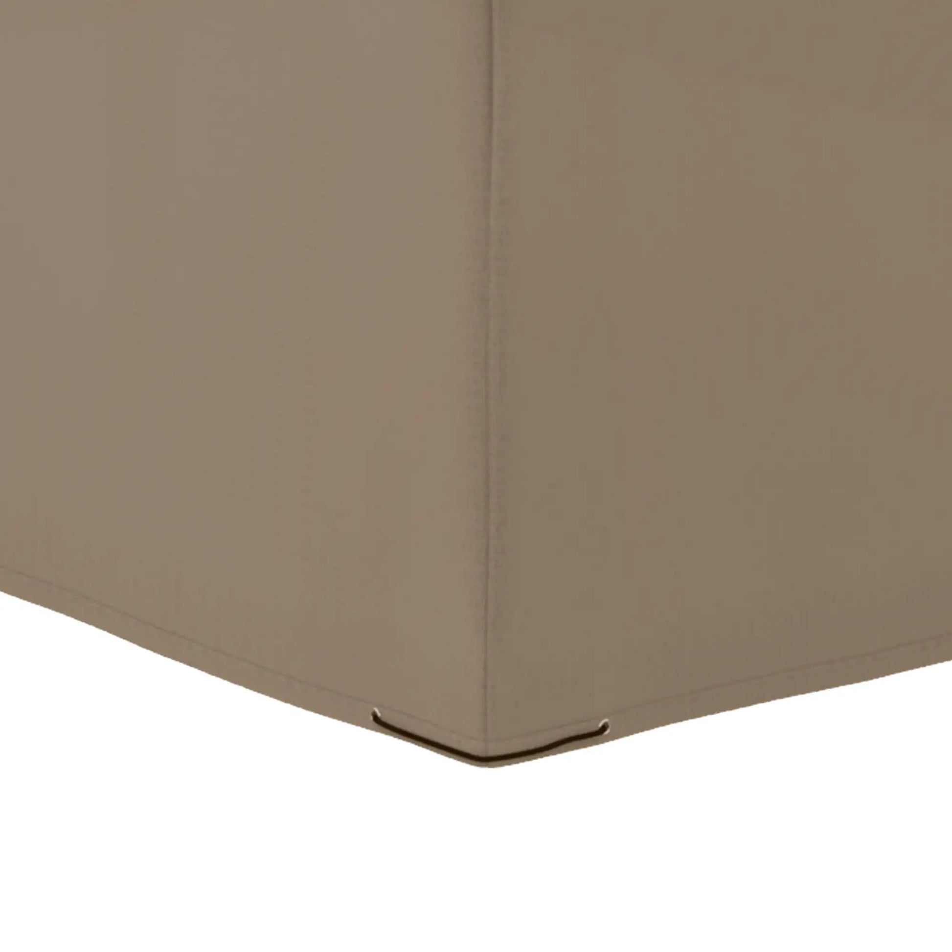 Close-up of a beige cube on a white background
