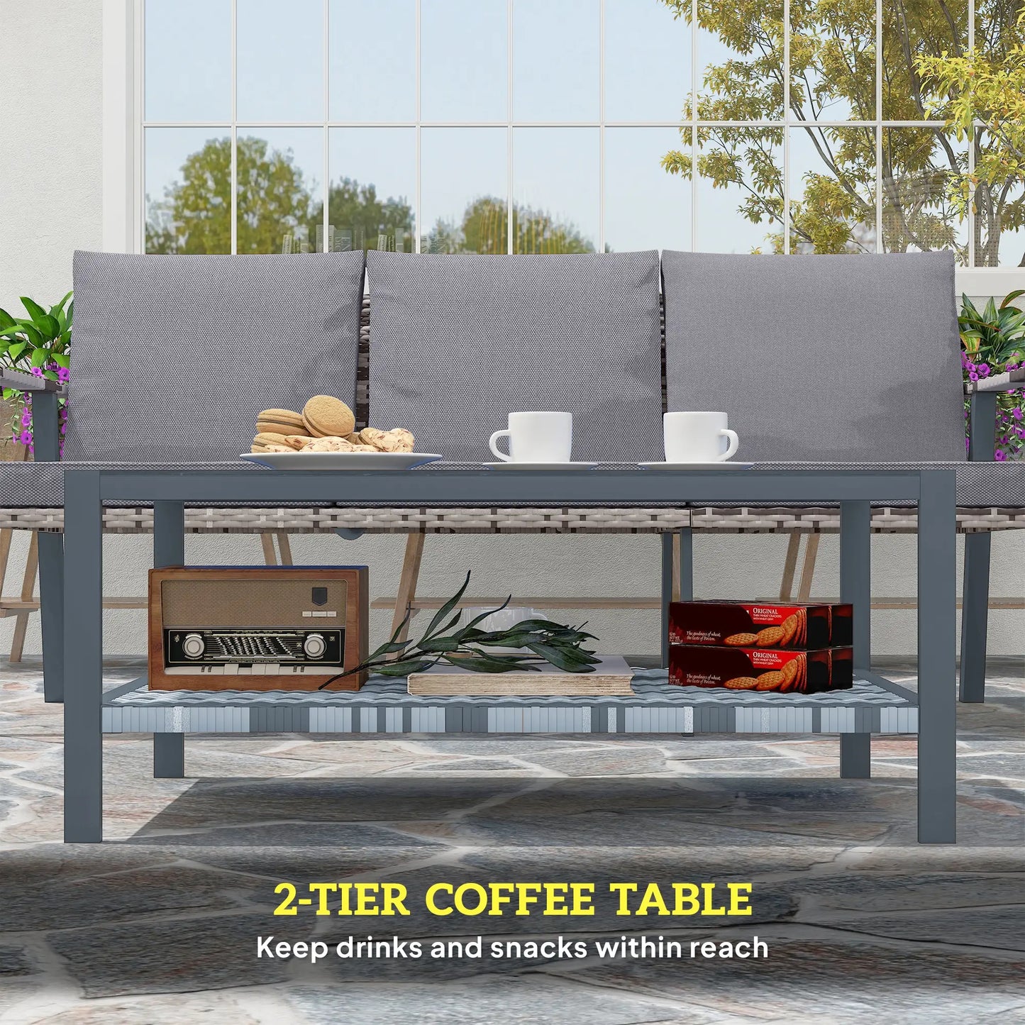 Outdoor setting with a 2-tier coffee table featuring drinks and snacks, surrounded by a patio area.