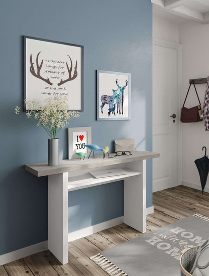 White desk against a blue wall with decorative items