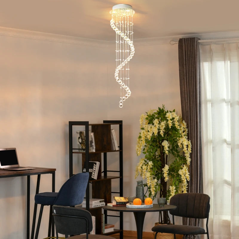 Modern interior with a spiral chandelier, bookshelf, and table with flowers.