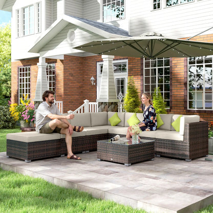 Two people sitting on a patio set with a house in the background