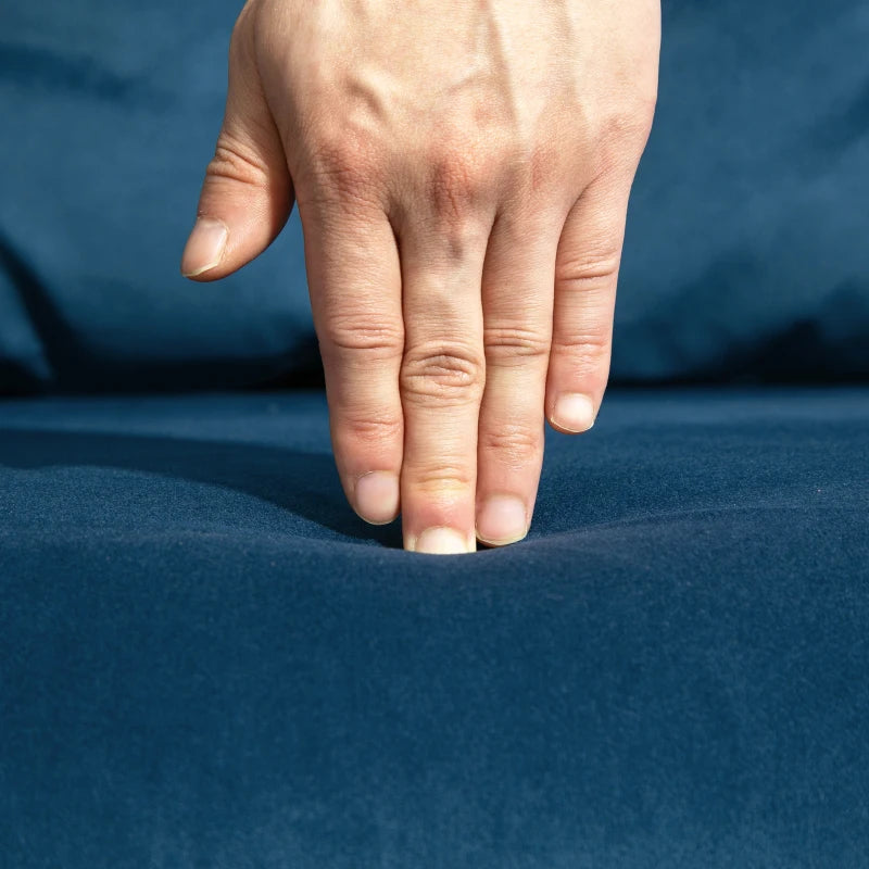 Hand touching a blue fabric surface