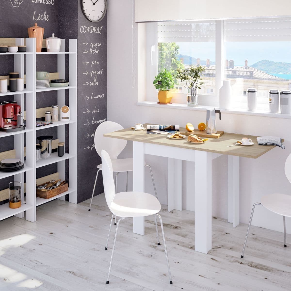 Modern kitchen with white cabinets, wooden countertops, and a chalkboard wall.