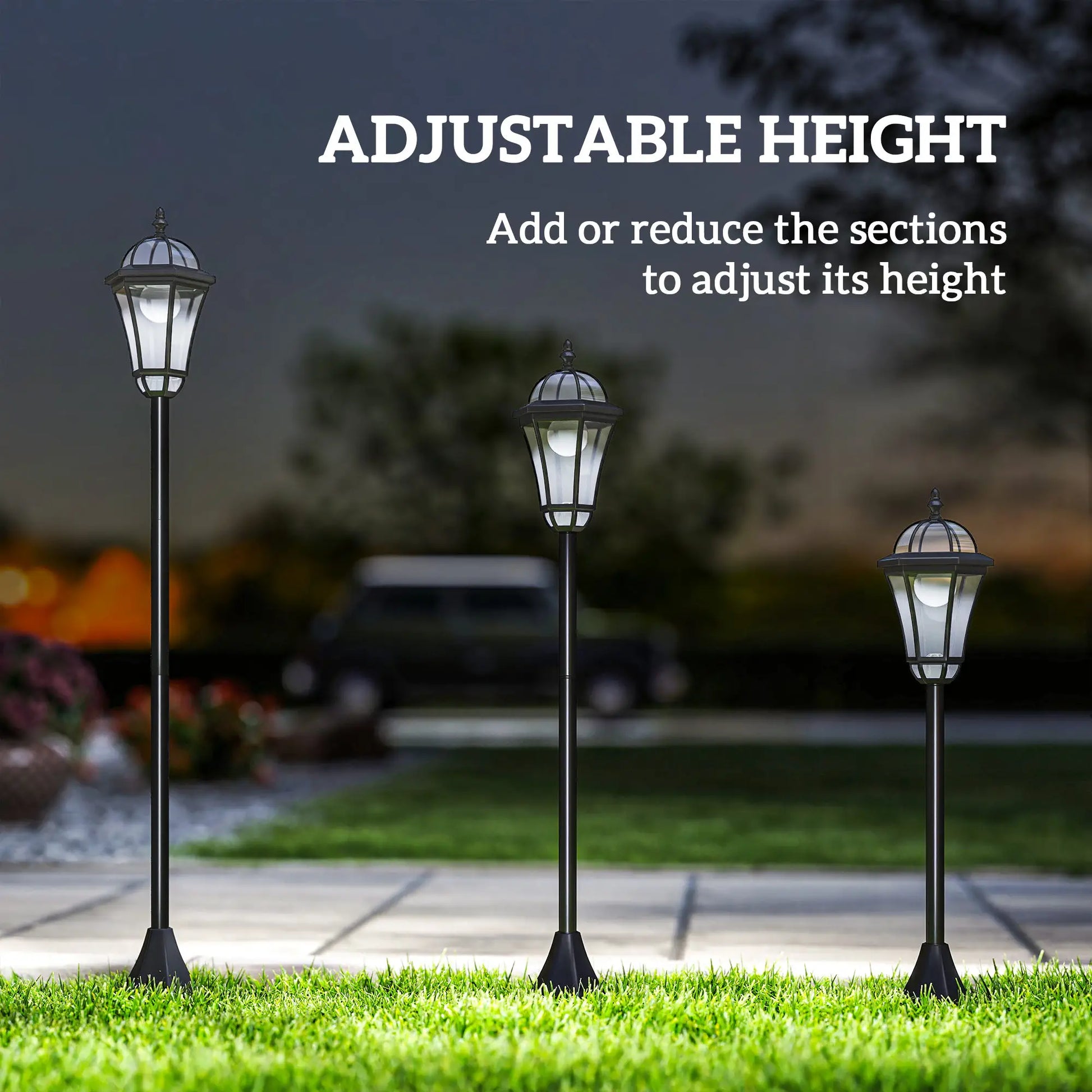 Three adjustable height outdoor lamps on grass with a dark sky background