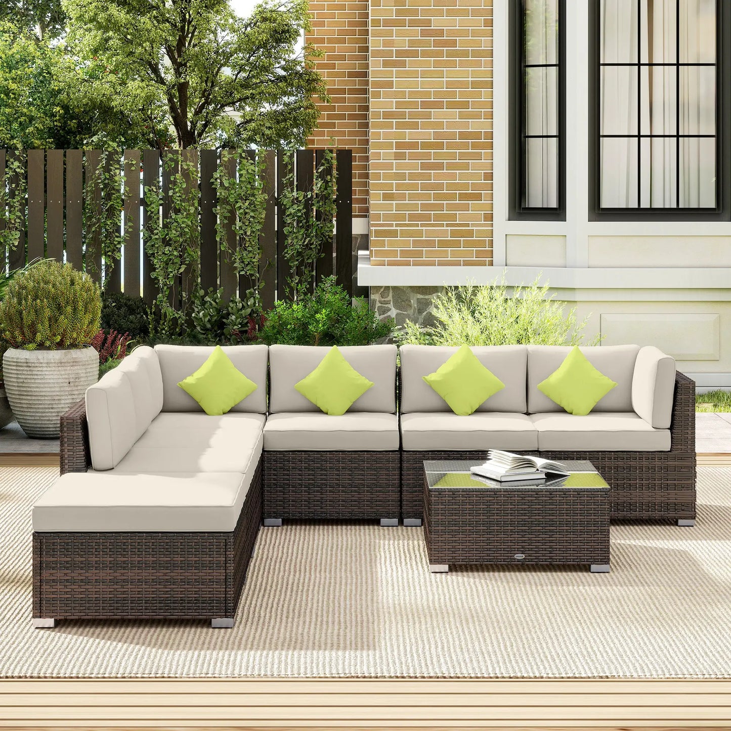 Outdoor patio furniture set with a sectional sofa and coffee table on a deck.