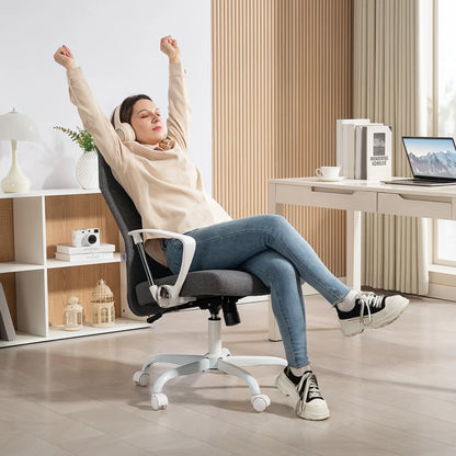 Woman relaxing on a modern office chair in a home office setting.